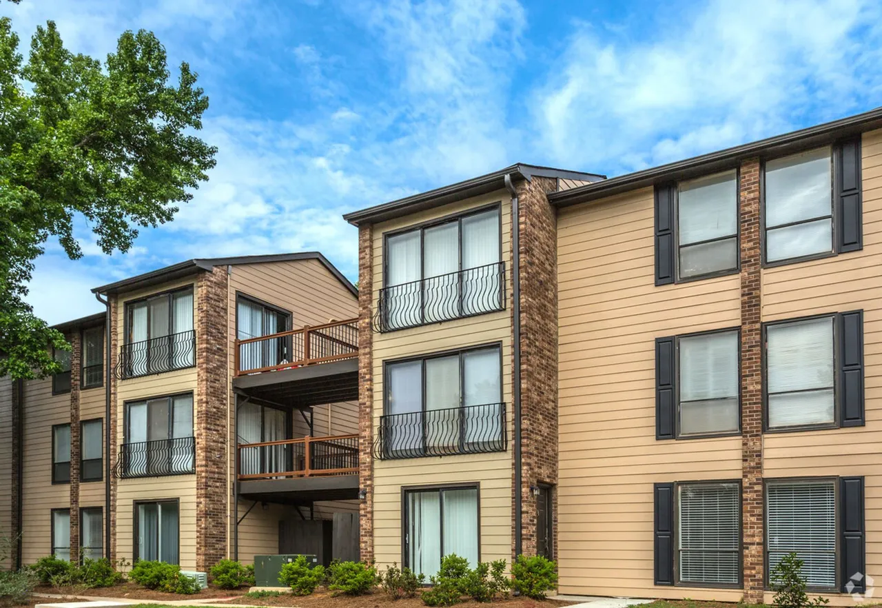Apartment buildings with balconies at The Woods at Camp Creek